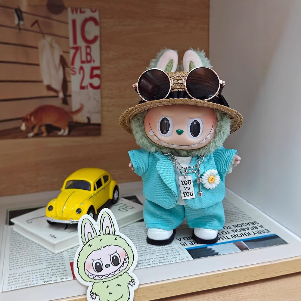 Labubu wearing a handmade G-Dragon inspired outfit – bold K-pop streetwear style with detailed accessories. Custom styles for Exciting Macaron, Big into Energy, and Have a Sit. Blue Mint Outfit. With yellow car.