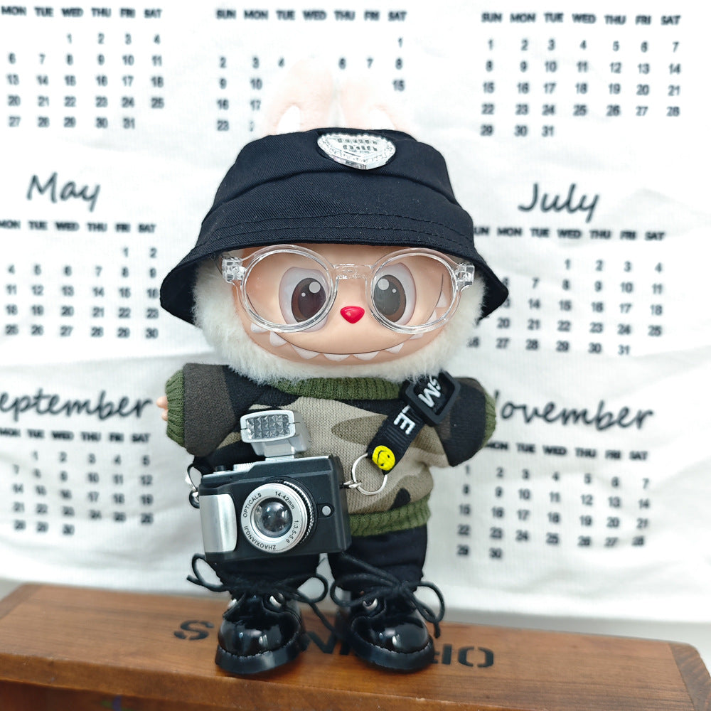 Shop LABUBU Urban Explorer Photographer Style clothes — handmade, stylish outfits inspired by streetwear and adventure for collectible toy fans. In front of a calender.
