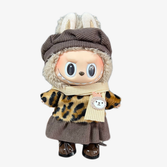 Labubu wearing a handmade Leopard Chic outfit — bold leopard print and chic styling for collectible designer toys. Custom styles for Exciting Macaron, Big into Energy, and Have a Sit.