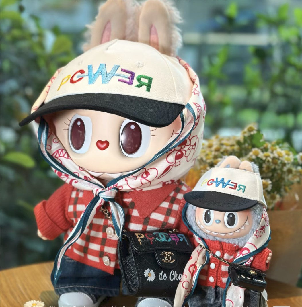 Labubu in a G-Dragon inspired outfit with stylish cap and patterned headscarf – bold K-pop streetwear look. With Mokoko and Zimomo.
