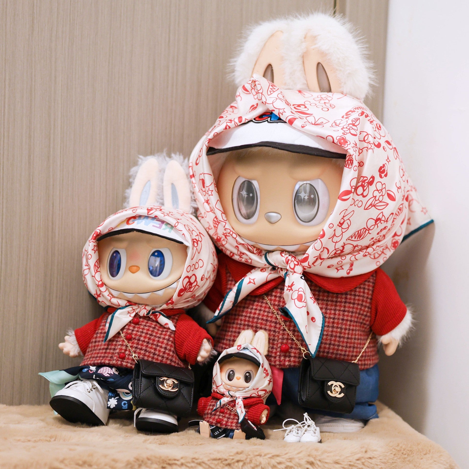 Labubu in a G-Dragon inspired outfit with stylish cap and patterned headscarf – bold K-pop streetwear look. With Mokoko and Zimomo.